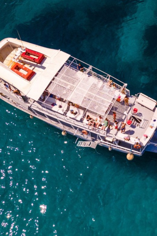 Rhodes: Sunset Cruise with Live Music, Wine & Greek Buffet - Who should book this Rhodes sunset cruise, and who might not