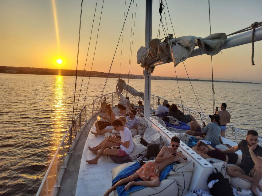 Rhodes: Sunset Cruise with Open Bar, Dinner, & Live Music - Lunch-hour energy, but at sunset: chef-led dinner on board
