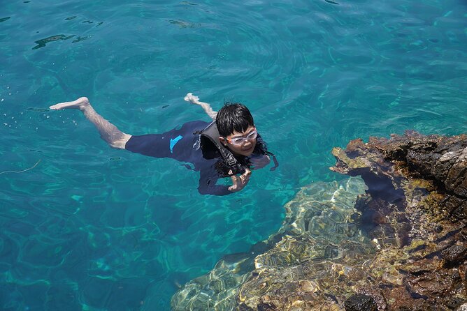 Rina Cave Sea Kayak Tour with Snorkeling and Picnic - Safety and instruction, how the crew keeps it fun even with wind