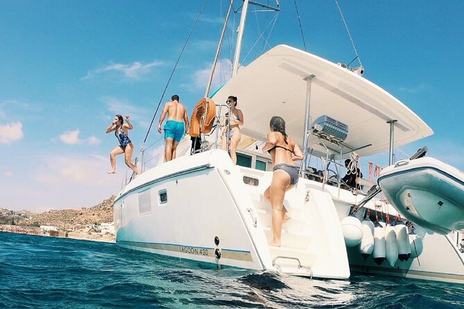 Sail the Athenian Coastline on a Catamaran with Meal & Wine - Stop 2, Vouliagmeni Bay: a popular spot with a rugged coastline