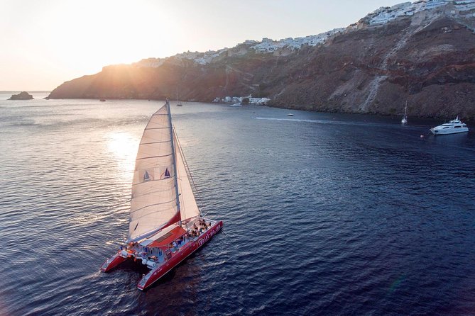 Sailing Catamaran Cruise in Santorini with BBQ, Drinks and Transfer - Stop 2, Red Beach: Fast Swim and Snorkel Time