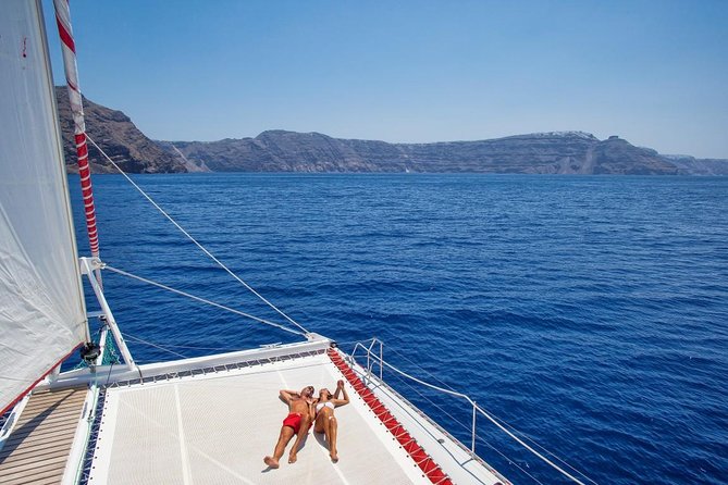 Sailing Catamaran Cruise in Santorini with BBQ, Drinks and Transfer - Stop 3, White Beach and BBQ: The Best Paying-Off Stop