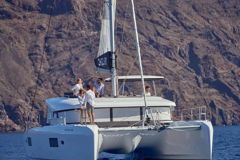 Santorini: Caldera Classic Catamaran Cruise w/ Meal & Drinks - Sunset option: sailing into the evening instead of fighting crowds