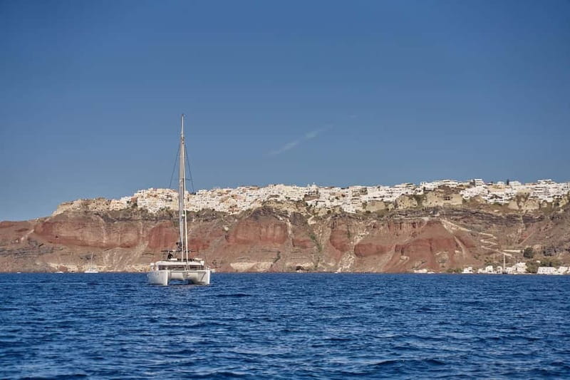 Santorini: Caldera Classic Catamaran Cruise w/ Meal & Drinks - White Beach: short photo time with cliffs that look sculpted