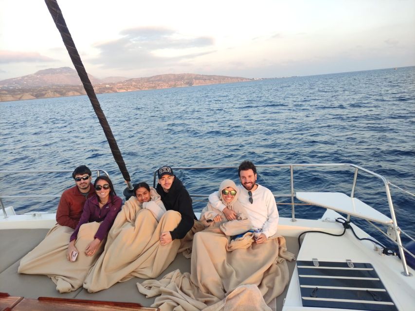 Santorini Caldera: Panorama Winter Cruise - Black Mountain and the lighthouse approach