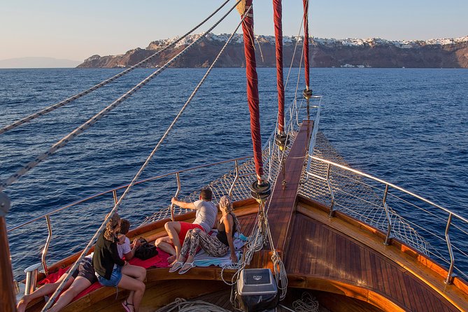 Santorini Caldera Sunset Sailing Cruise with Dinner and Wine - Thirassia Bay Dinner on Board: Greek Buffet, Complimentary Wine, and a Calmer Moment