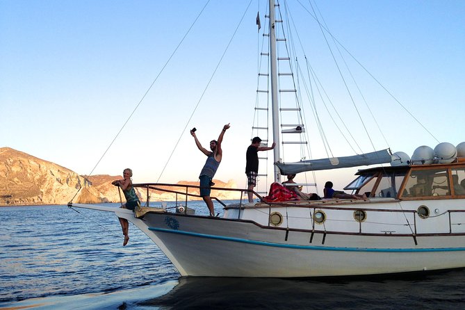 Santorini Caldera Sunset Traditional Cruise with Meal and Drinks - Why a traditional wood-boat cruise feels different on Santorini