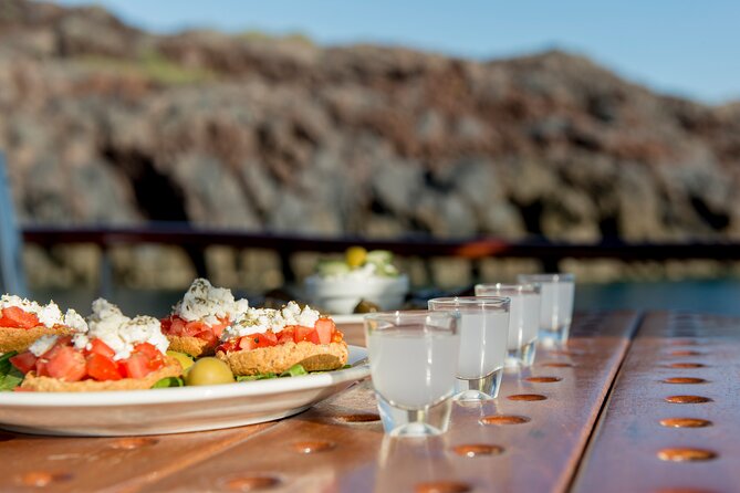 Santorini Caldera Sunset Traditional Cruise with Meal and Drinks - Mesa Pigadia, White Beach, and Red Beach: short stops for big scenery