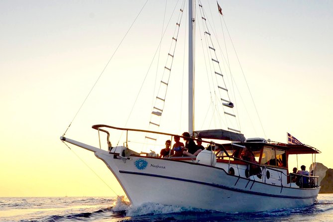 Santorini Caldera Sunset Traditional Cruise with Meal and Drinks - Food and drinks onboard: Greek classics, local wine, and real value