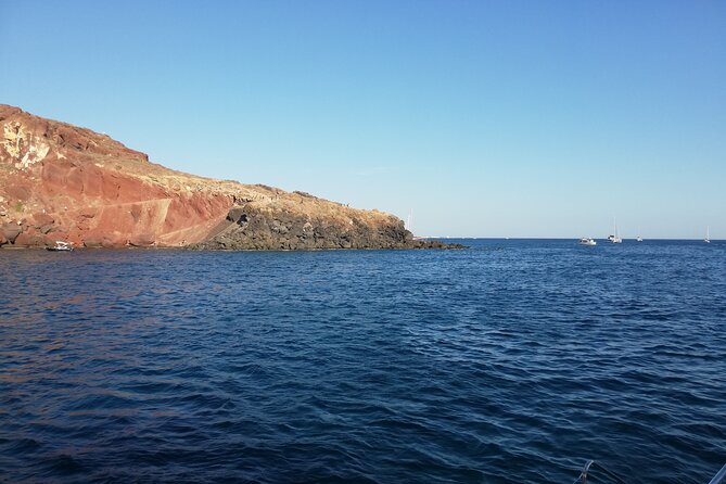 Santorini Catamaran Cruise with Fresh Meal and Open Bar - Red Beach Stop: Rust-Colored Rocks, Easy Photos, and a Real Swim Break