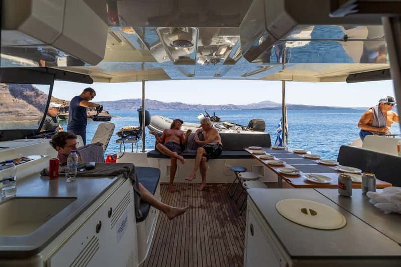Santorini: Catamaran Cruise with Fresh Meal & Open Bar - Black Mountain coves: goggles, a simple approach to snorkeling, and real swim time