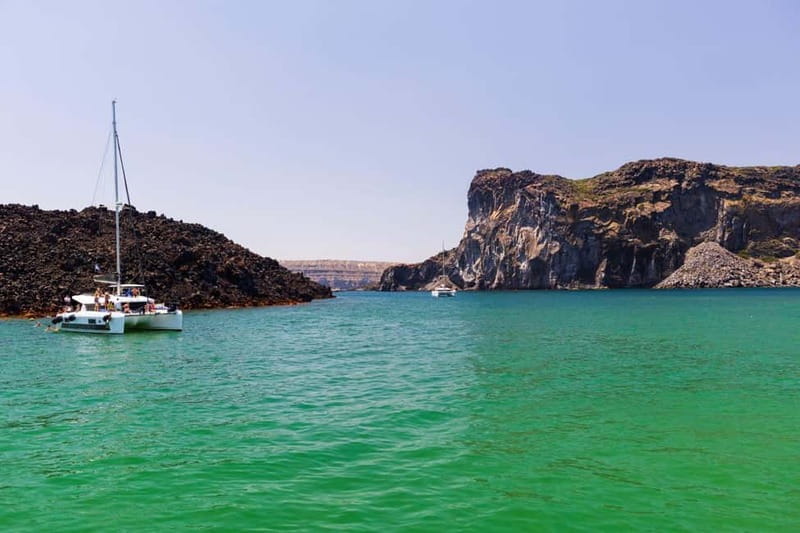Santorini: Catamaran Cruise with Fresh Meal & Open Bar - Akrotiri Lighthouse: the guided caldera moment you will remember