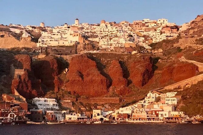Santorini Catamaran Cruise with Greek Meal, Open-Bar and Sunset - Cruising Past Lighthouse, Caldera Rims, and Southern Beaches