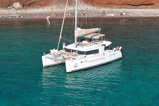 Santorini Catamaran Cruise: with Lunch, BBQ, Open Bar, Transfers - Vlychada Marina pickup and a 5-hour catamaran rhythm