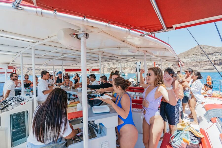 Santorini: Catamaran Tour with BBQ Dinner, Drinks, and Music - Crew energy and named standouts you may run into
