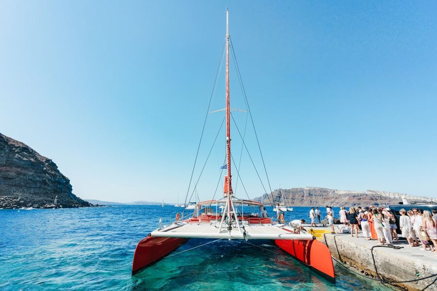 Santorini: Catamaran Tour with BBQ Dinner, Drinks, and Music - Boarding: Ocean Voyager or Tahiti catamaran, and where you’ll spend your time