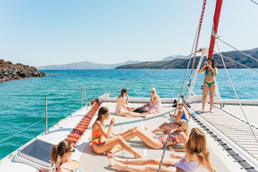 Santorini: Catamaran Tour with BBQ Dinner, Drinks, and Music - Stop 1: Hot Springs swim, sulfur water, and a first taste of the caldera