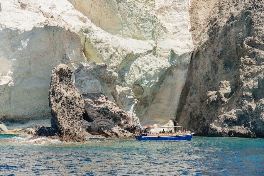 Santorini: Catamaran Tour with BBQ Dinner, Drinks, and Music - Stop 3: White Beach, towering cliffs, and a sea-only perspective