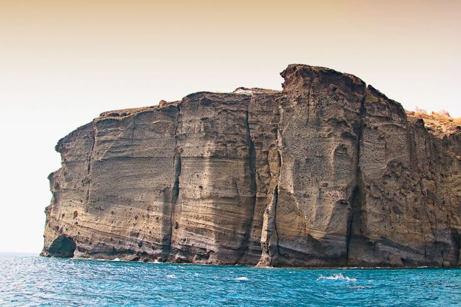 Santorini: Day Cruise with Meal & Open Bar - White Beach, Black Mountain, and the Lighthouse South of the Caldera