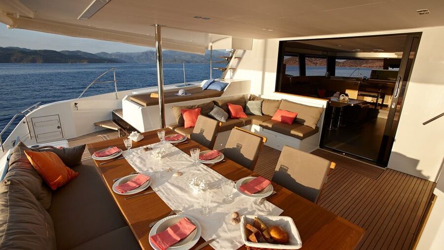 Santorini: Luxurious Catamaran Cruise with Meal & Open Bar - Boarding at Amoudi: What the First Hour Feels Like
