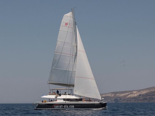 Santorini Luxury Catamaran Day Cruise with BBQ,drinks,transfer - From Ammoudi Port: pickup, boarding, and what the morning feels like