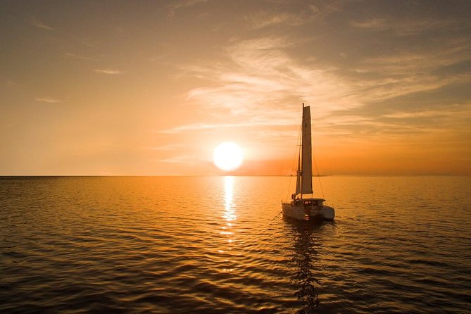 Santorini Luxury Catamaran Sunset Cruise with BBQ, Drink and Transfer - Hot Springs Stop: The Warm Dip Near the Volcanic Area