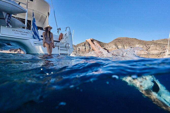 Santorini Oia: Luxury Sunset Cruise with Fresh Fish BBQ & Drinks - Mesa Pigadia Beach: secluded, rocky, and made for a quick snorkel