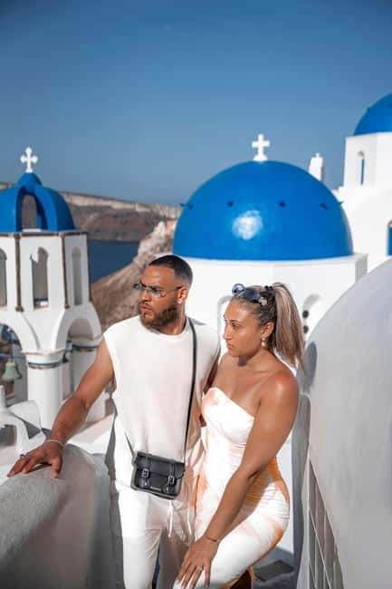 Santorini: Oia Private Couple Photoshoot with 35 Photos - Oia village walk: whitewashed streets, blue domes, and sea views you can frame