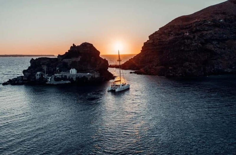 Santorini: Private Catamaran Cruise with BBQ Meal and Drinks - Thirassia, Manolas village, and the calmer side of the Caldera