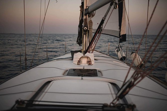 Santorini Private Sunset Sailing Tour with Dinner, Drinks &Transfer included - Red Beach and White Beach: classic volcanic stops, seen correctly