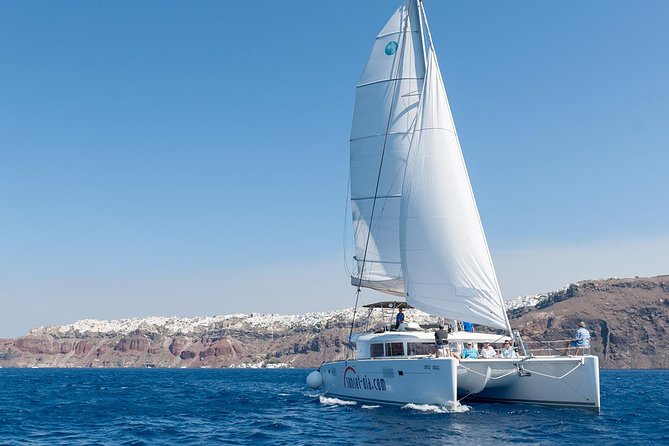 Santorini Small-Group Catamaran Sailing Trip(BBQ,drinks, transfer) - The sailing route: caldera views, lighthouse from the sea, and Palea Kameni