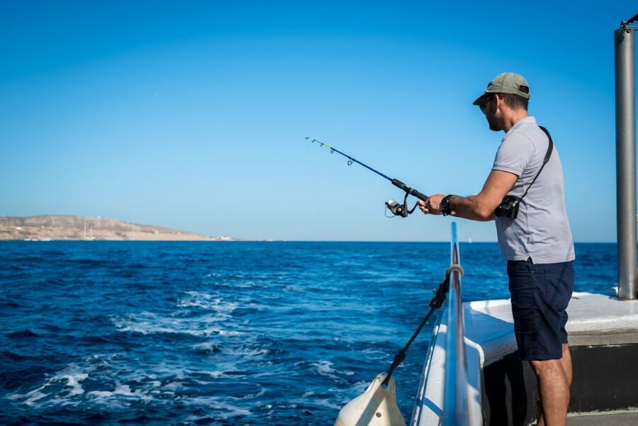 Santorini Sunset Fishing Trip with Dinner and Drinks - Cruising the south coast: Red, White, Black Beach and Indian Rock