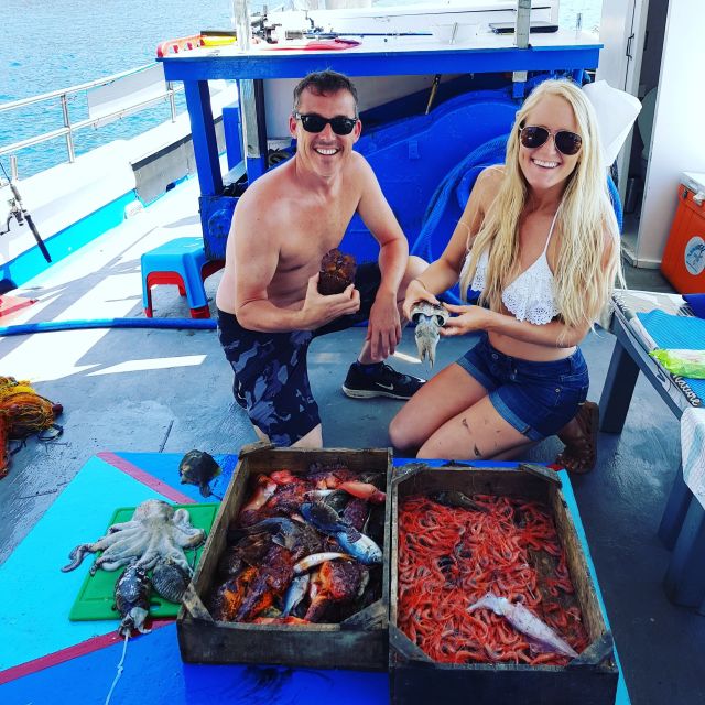 Santorini Sunset Fishing Trip with Dinner and Drinks - Swim and snorkel: when the sea turns into a lesson