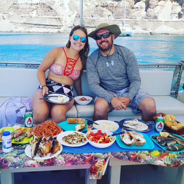 Santorini Sunset Fishing Trip with Dinner and Drinks - From lines to dinner: cooking fresh catch aboard