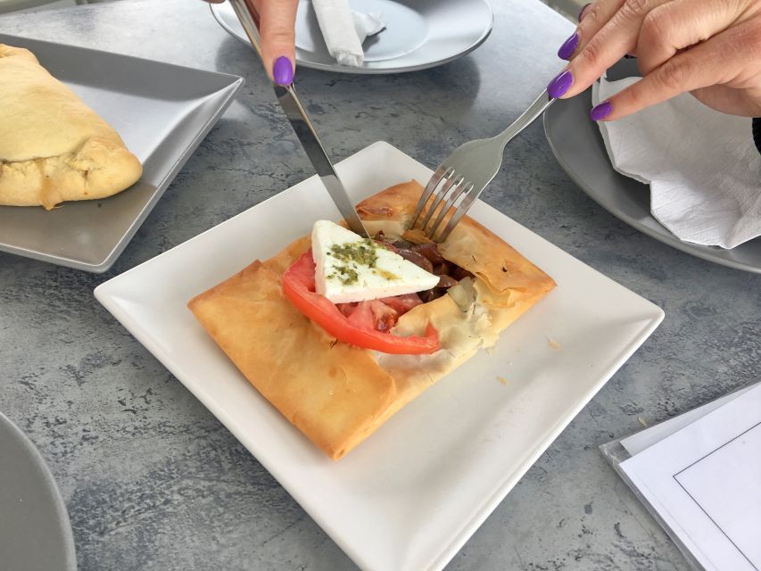 Santorini: Sunset Walking Tour with Local Food and Drinks - Volkan on the Rocks: Beer, Tapas, and Caldera Timing