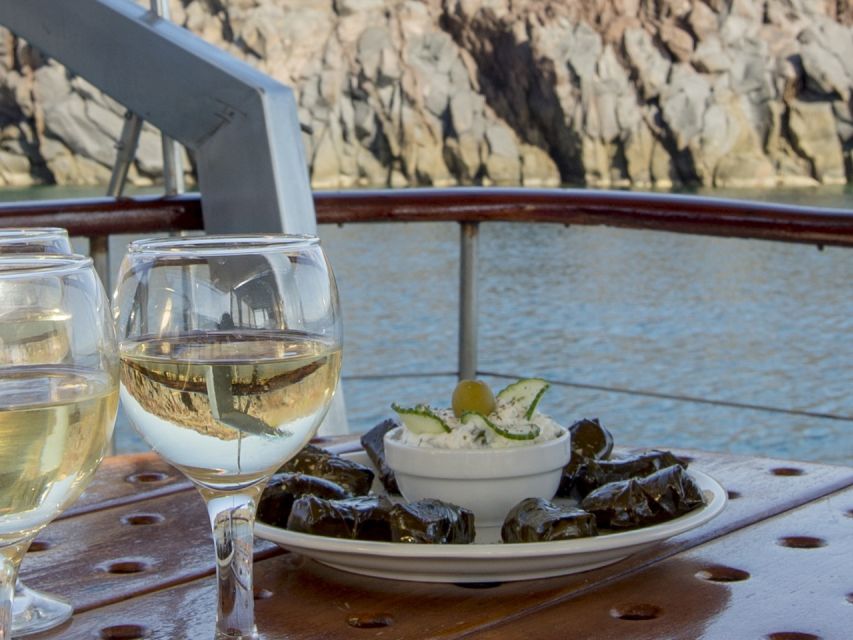 Santorini: Traditional Wooden Boat Tour with Meal and Wine - Red Beach and White Beach Stops: Sightseeing With a Swim Payoff