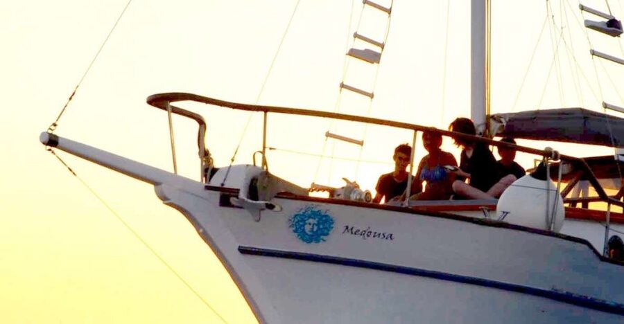 Santorini: Traditional Wooden Boat Tour with Meal and Wine - Black Mountain Swim and Snorkeling in Clear Water
