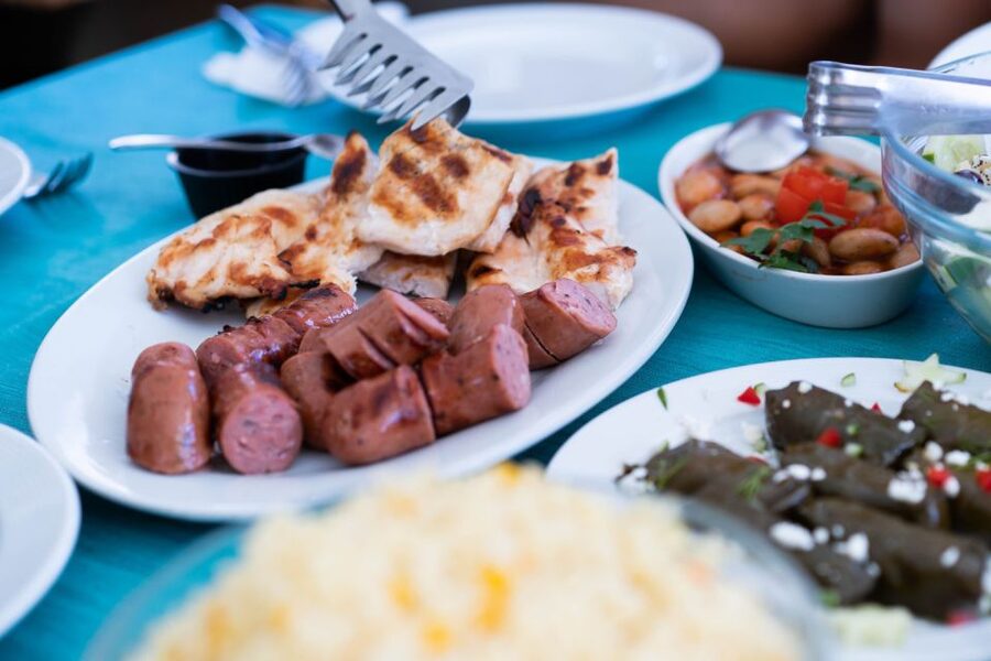 Santorini: Traditional Wooden Boat Tour with Meal and Wine - Santorini Volcano Photo Moment and More Snorkeling