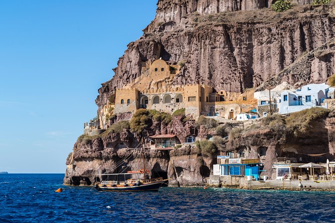 Santorini Volcano and Hot Springs Cruise Tour from Fira Old Port - Boat ride experience: shade, drinks, and the pace of a working crew