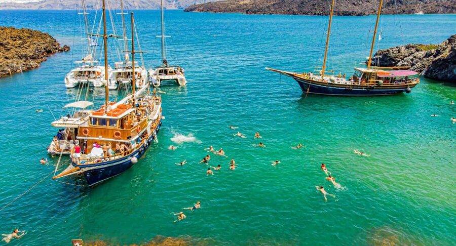 Santorini Volcano, Hot Springs Adventure - Meeting at the Old Port of Fira, then getting on the boat