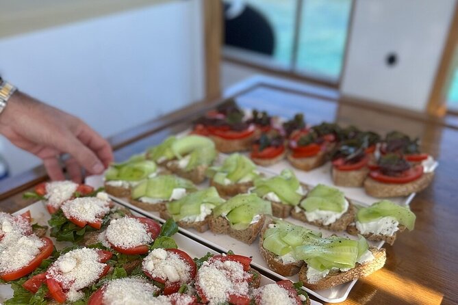 Small Group Kaiki Cruise & Greek Gastronomy Experience - Agios Nikolas and the intro swim: chapel views plus an on-board snack