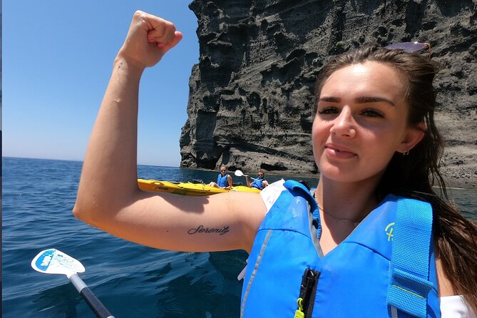 Small-Group Santorini Sea Caves Kayak Trip with Snorkeling & Picnic - Sea Caves and the Black Mountain: The Blue-Light Moment People Chase