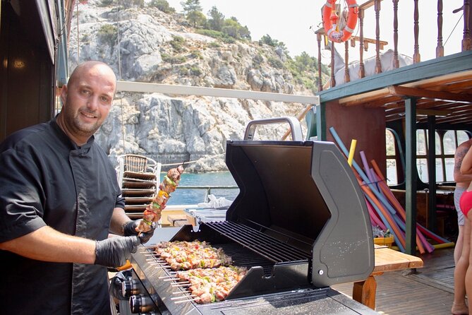 Sun & Sea 6 Hour All Inclusive Swimming Cruise with Greek BBQ & Unlimited Drinks - Swim Stop 1: Anthony Quinn Bay, the movie-linked favorite