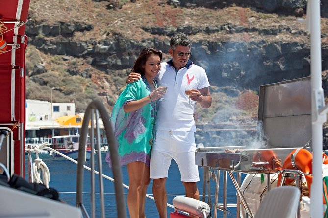 Sunset Sailing Catamaran Cruise in Santorini with BBQ and Drinks - Getting to the port without stress: pickup, shoes, and timing