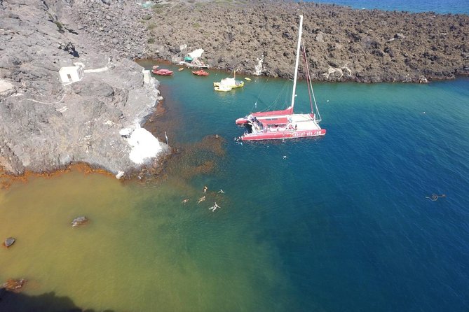 Sunset Sailing Catamaran Cruise in Santorini with BBQ and Drinks - Red Beach snorkeling stop: short time, different color rock